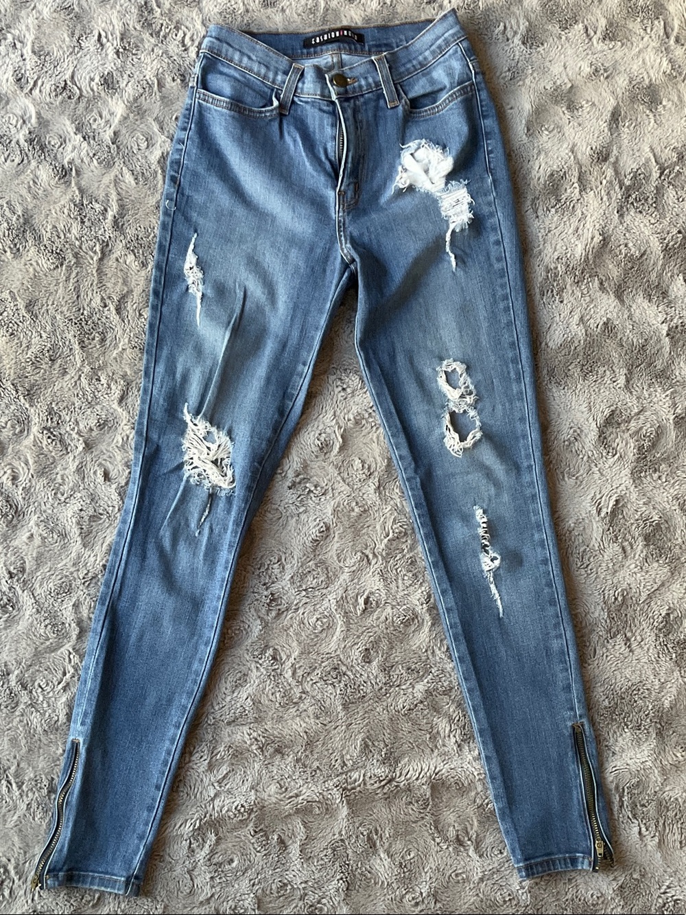 Light Blue Distressed Ankle Zip Jeans
